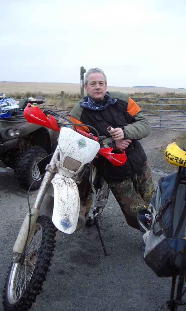 Picture of Colin Horn, Managing Director and founder of Grosvenor Interiors on a motorbike.